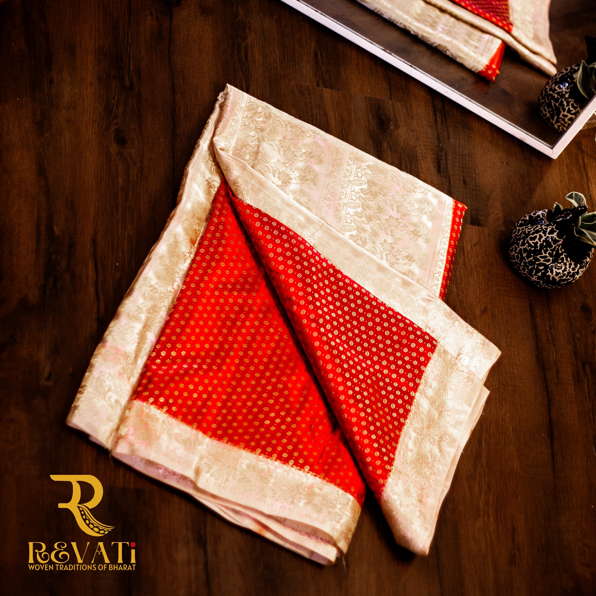 Banarasi beauty in deep red silk, featuring golden buti work and a rich floral zari border.