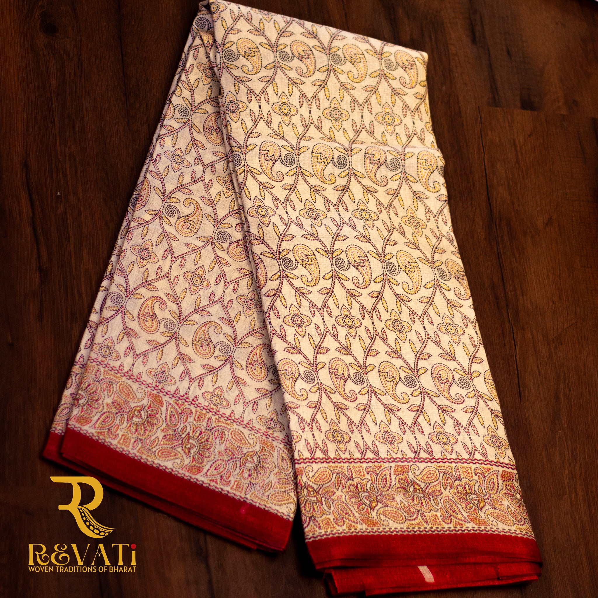 Beige Banarasi silk saree with intricate zari florals, maroon brocade borders, and a rich heritage pallu.