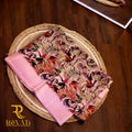 Beige linen-blend saree adorned with bold pastel florals in soft hues and finished with an elegant pink woven border.