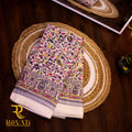 Creamy white linen-cotton saree with vibrant florals and soft thread-highlighted borders
