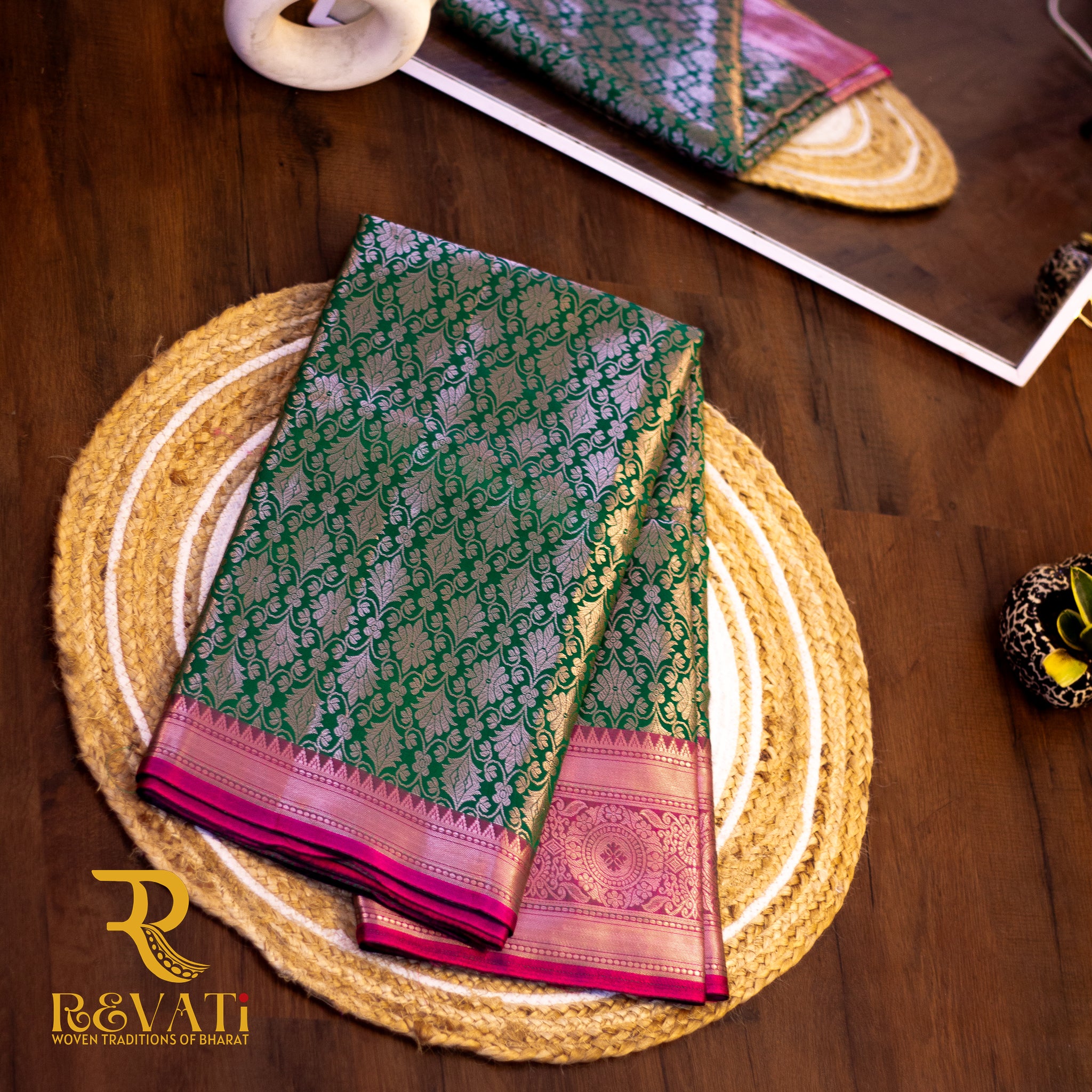 Emerald Green Kanjivaram Soft Silk Saree adorned with Golden Floral Motifs, a Rich Pink Brocade Border, and a Traditional Pallu