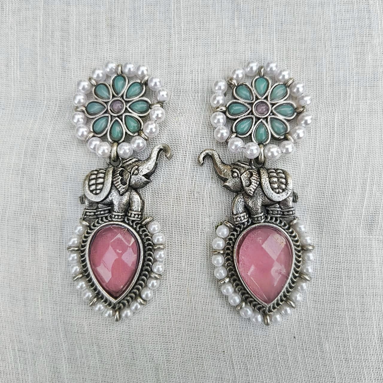 Handcrafted Silver Elephant Earrings with Green Gemstone & Pearl Detailing – Ethnic Jewelry